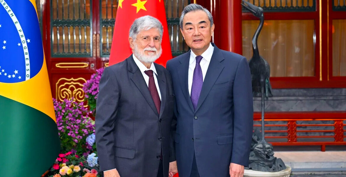 Wang Yi (right), China’s foreign minister, welcomes Celso Amorim, a top adviser to Brazilian President Luiz Inacio Lula da Silva