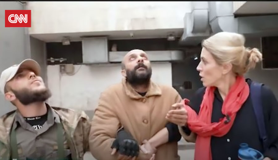 CNN journalist Clarissa Ward and Salama Mohammad Salama, a Syrian intelligence officer. 