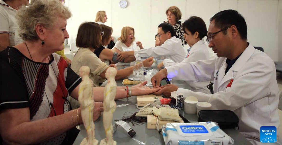 Members of the 20th Chinese medical team for Malta offer health consultations to local residents in Swieqi, Malta
