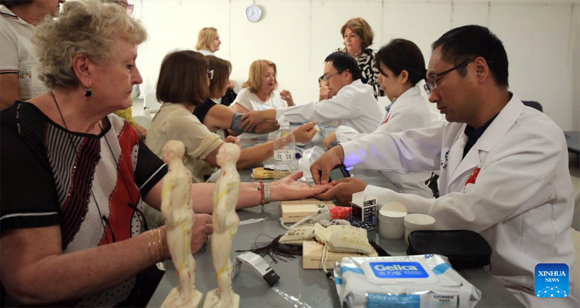 Members of the 20th Chinese medical team for Malta offer health consultations to local residents in Swieqi, Malta
